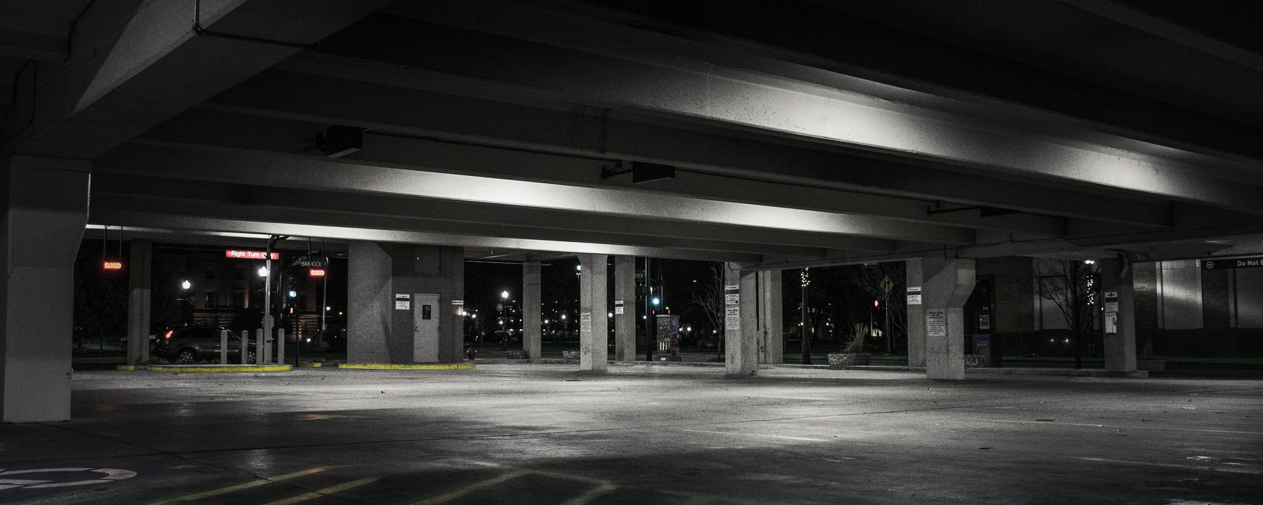 An empty car park deck lit up at night