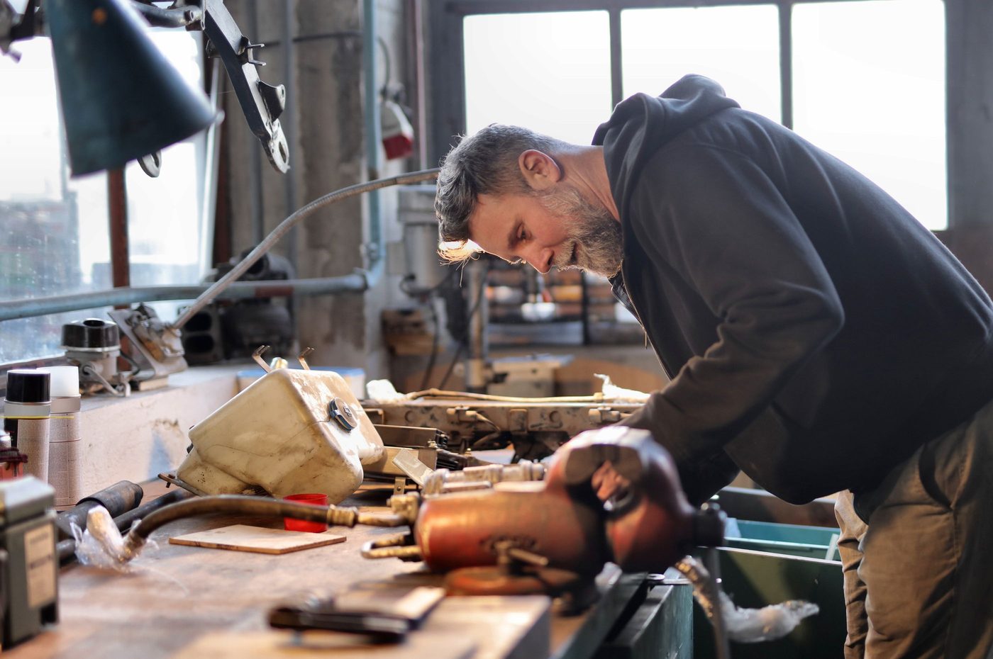 An owner working at the bench in his own workshop