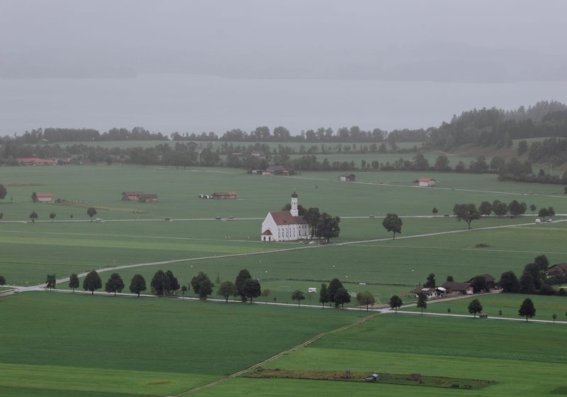 Flat Bavarian countryside with a church and fields