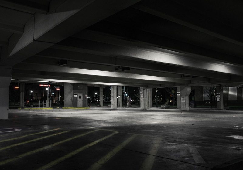 An empty car park deck lit up at night